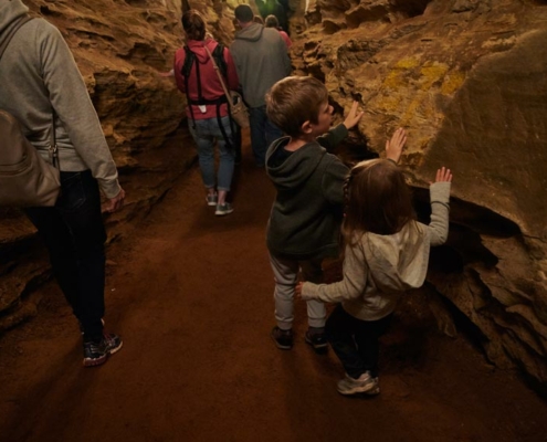 Laurel Caverns Children feeling the cave walls